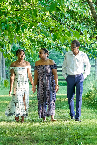 Family walking in a wooded path