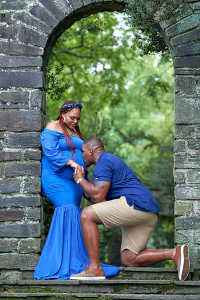 Couple standing in front of a tree